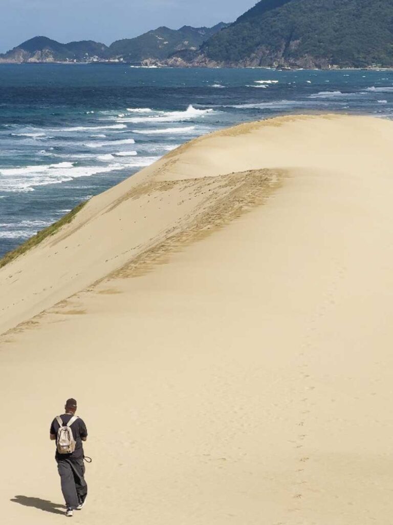 Sam walking along the Tottori Sand Dunes