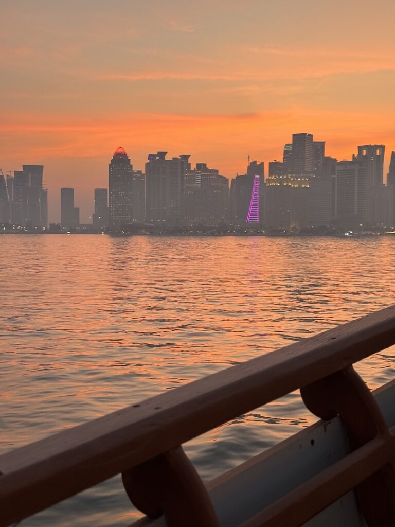 Traditional dhow boat cruise with the Doha skyline at sunset