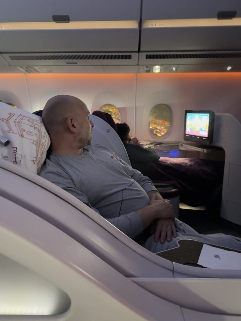 Qatar Airways Business Class cabin on our flight to Doha