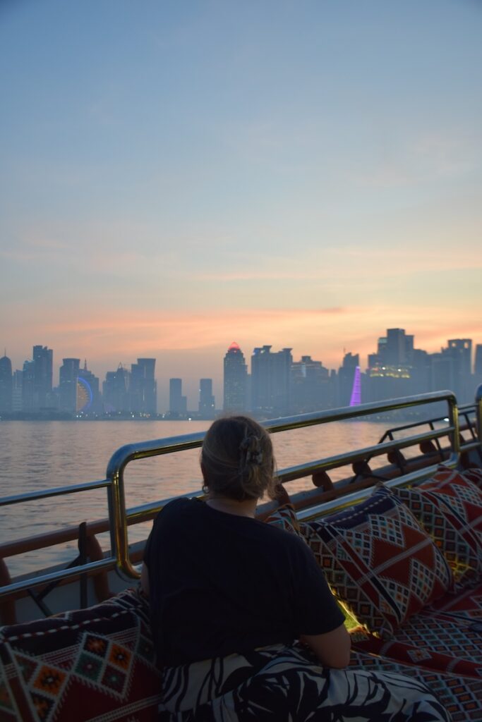 Traditional dhow boat cruise with the Doha skyline at sunset