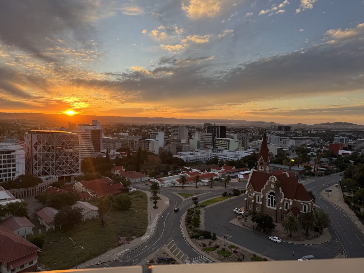 Sunset over central Windhoek with Christuskirche and the surrounding hills