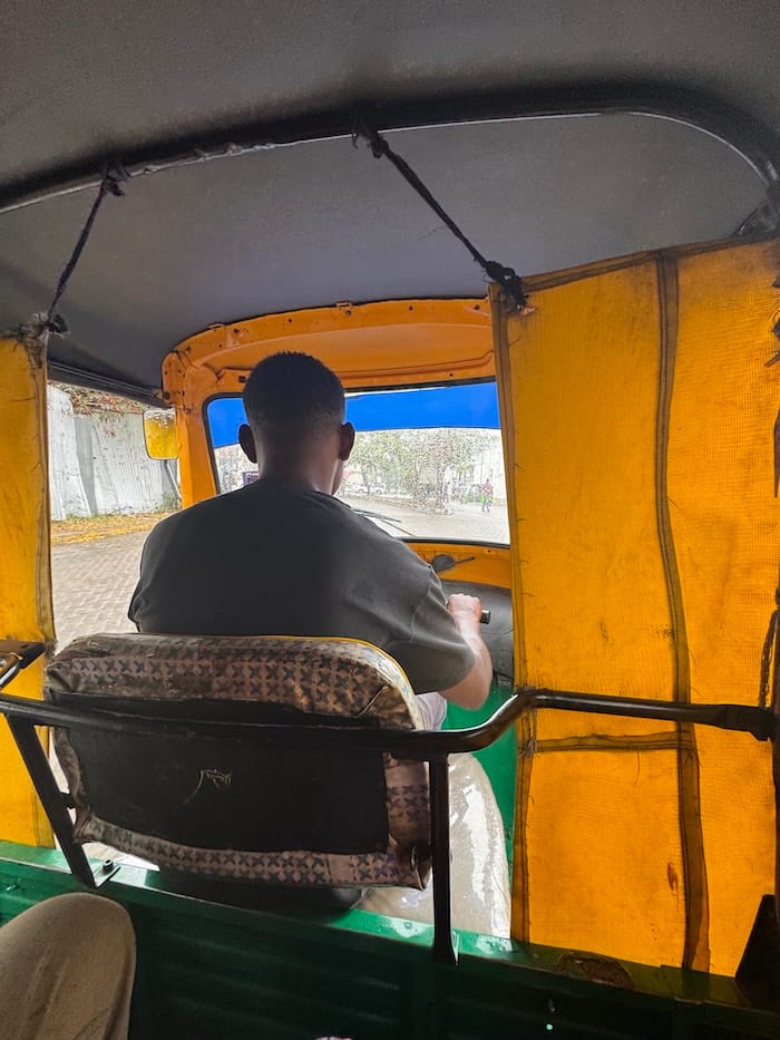 Tuk-tuk driving through the streets of Mombasa