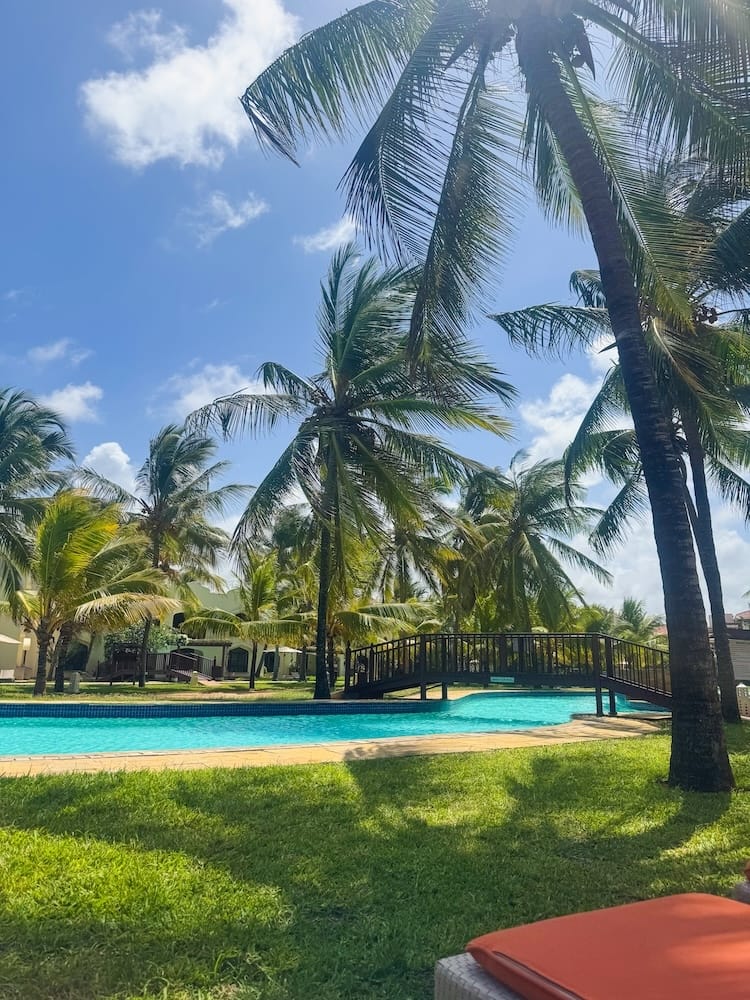 Swimming pool at Silver Resort in Kilifi, Kenya, surrounded by tropical greenery.
