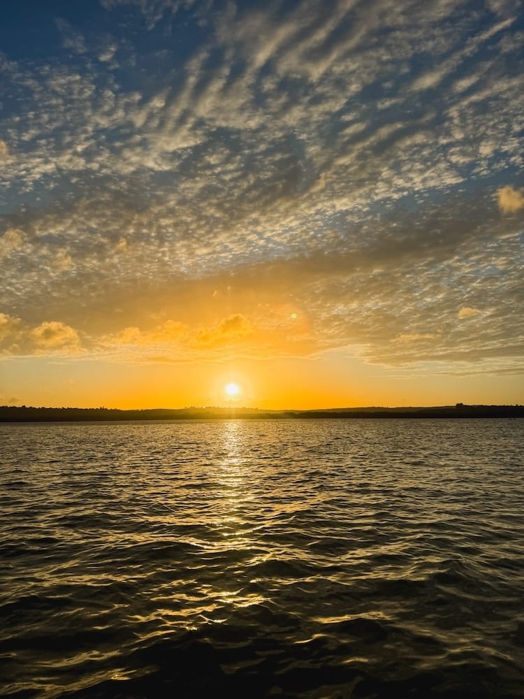 Beautiful golden-hour views across Kilifi Creek during a sunset dhow ride.